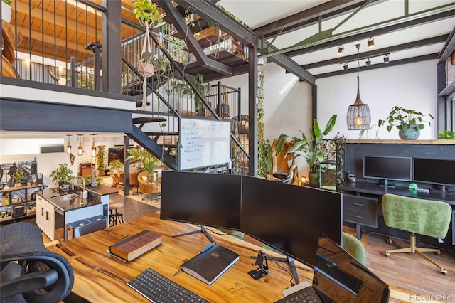 1203 24th St, Denver, CO 80205 - office featuring wood finished floors, a sink, beamed ceiling, and a high ceiling