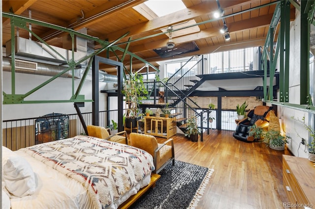 1203 24th St, Denver, CO 80205 - bedroom with wooden ceiling with exposed beams and hardwood / wood-style flooring