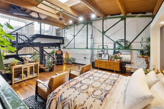 1203 24th St, Denver, CO 80205 - bedroom with wood finished floors and wooden ceiling with exposed beams