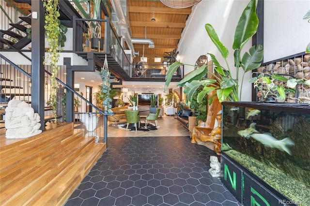 1203 24th St, Denver, CO 80205 - common area with stairs, a high ceiling, and wooden ceiling with exposed beams
