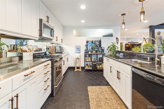 1203 24th St, Denver, CO 80205 - kitchen featuring appliances with stainless steel finishes, stainless steel counters, white cabinets, recessed lighting, and decorative light fixtures