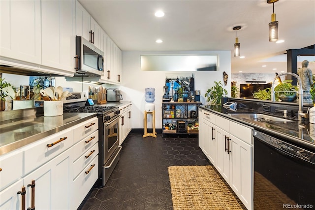 1203 24th St, Denver, CO 80205 - kitchen featuring stainless steel appliances, stainless steel counters, white cabinetry, recessed lighting, and decorative light fixtures
