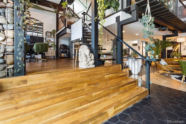 1203 24th St, Denver, CO 80205 - stairs featuring a towering ceiling, recessed lighting, and wood finished floors