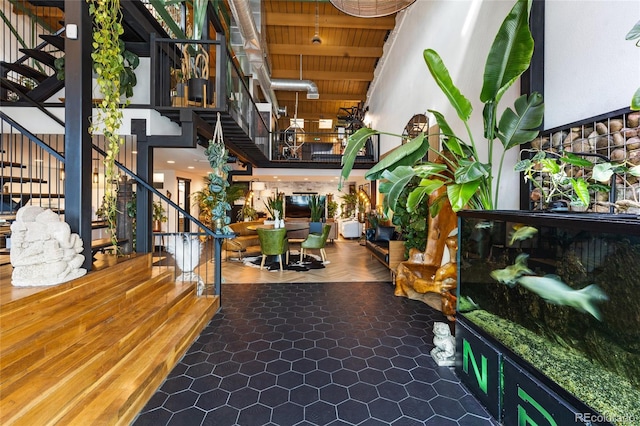 1203 24th St, Denver, CO 80205 - community lobby with stairway, a high ceiling, and wooden ceiling