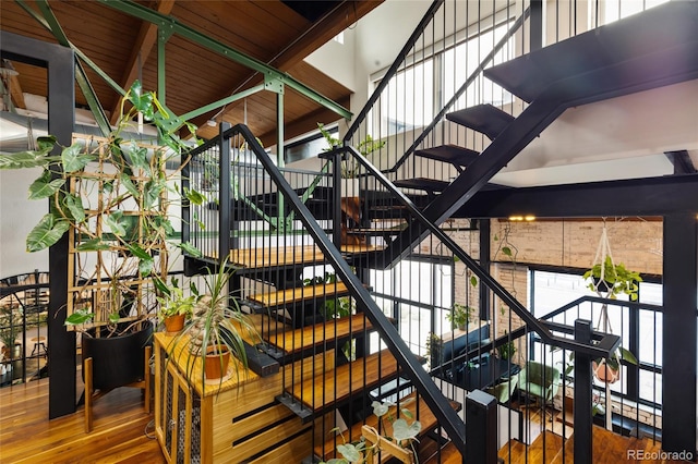 1203 24th St, Denver, CO 80205 - stairs with wood finished floors and a towering ceiling