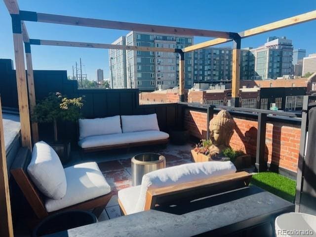 1203 24th St, Denver, CO 80205 - view of patio with a view of city and an outdoor hangout area