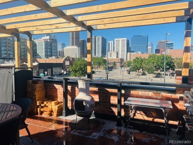 1203 24th St, Denver, CO 80205 - patio / terrace with a view of skyline