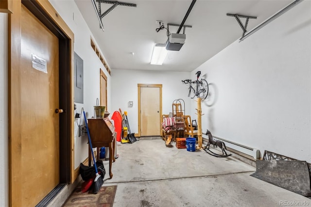 garage featuring a baseboard heating unit and a garage door opener