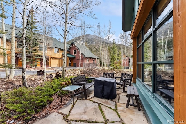 view of patio / terrace featuring a mountain view