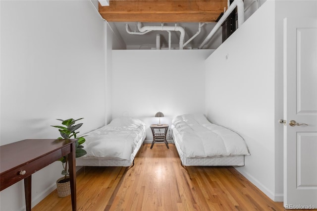 bedroom featuring wood-type flooring