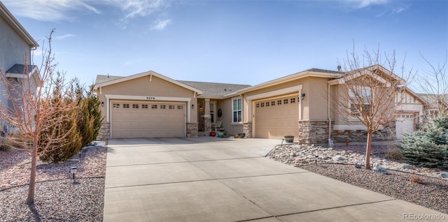 5279 Mount Cutler Ct, Colorado Springs, CO 80924 - ranch-style home with a garage, stucco siding, stone siding, and concrete driveway
