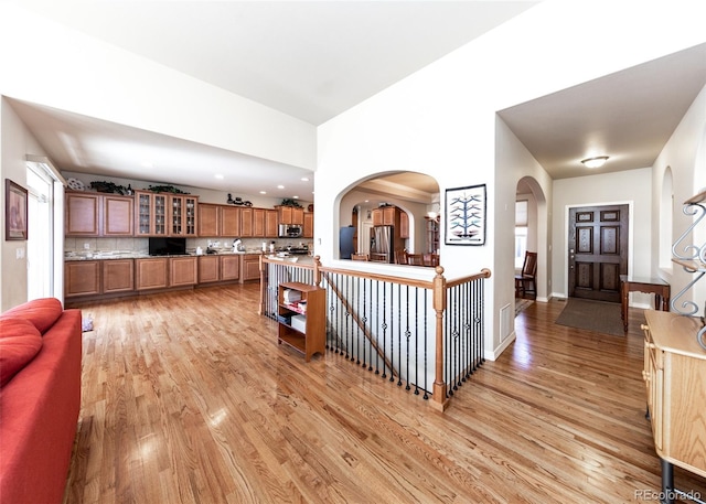 5279 Mount Cutler Ct, Colorado Springs, CO 80924 - interior space with recessed lighting, arched walkways, baseboards, and light wood-type flooring