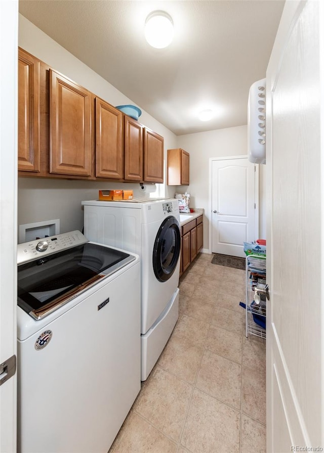 5279 Mount Cutler Ct, Colorado Springs, CO 80924 - clothes washing area with cabinet space, independent washer and dryer, and light tile patterned floors