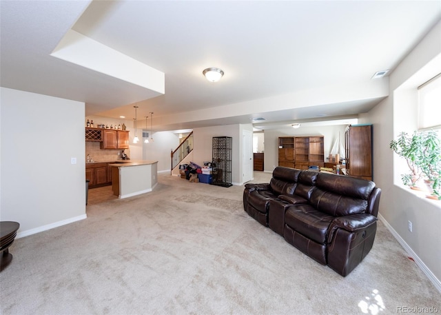 5279 Mount Cutler Ct, Colorado Springs, CO 80924 - living room with light colored carpet, stairs, baseboards, and visible vents