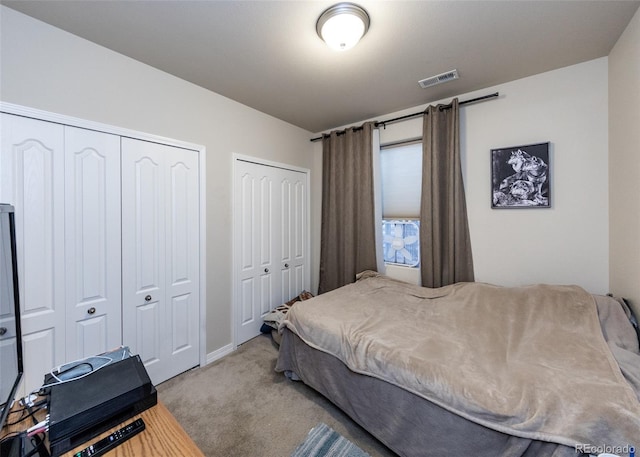 5279 Mount Cutler Ct, Colorado Springs, CO 80924 - bedroom with multiple closets, visible vents, baseboards, and carpet