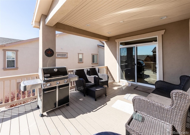 5279 Mount Cutler Ct, Colorado Springs, CO 80924 - deck featuring grilling area, an outdoor hangout area, and visible vents