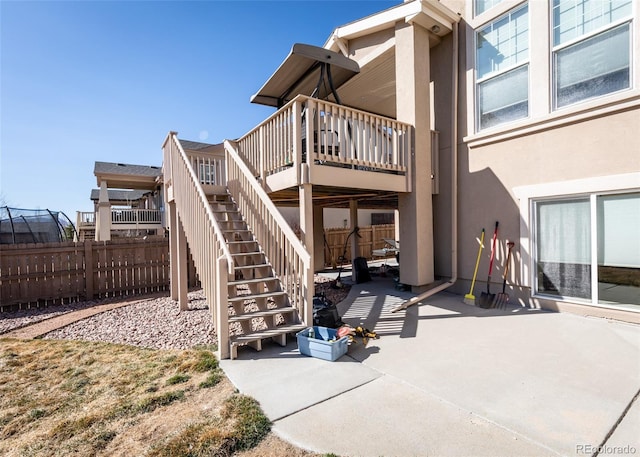 5279 Mount Cutler Ct, Colorado Springs, CO 80924 - view of patio / terrace featuring stairs, fence, and a wooden deck