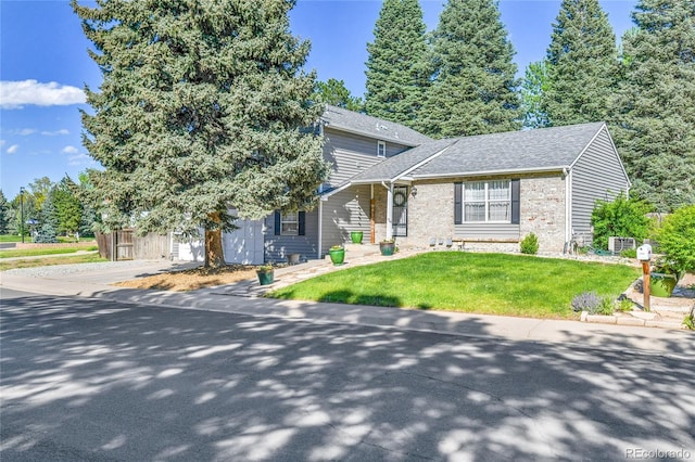 4782 E Costilla Ave, Centennial, CO 80122 - view of front of property featuring a front yard, brick siding, driveway, and roof with shingles