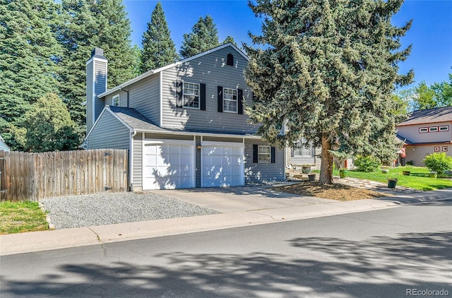 4782 E Costilla Ave, Centennial, CO 80122 - view of front facade featuring a chimney, concrete driveway, and an attached garage