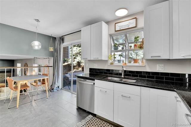 4782 E Costilla Ave, Centennial, CO 80122 - kitchen featuring dishwasher, a sink, white cabinets, tile patterned flooring, and dark stone countertops