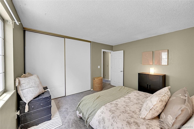4782 E Costilla Ave, Centennial, CO 80122 - bedroom featuring carpet flooring, a closet, and a textured ceiling