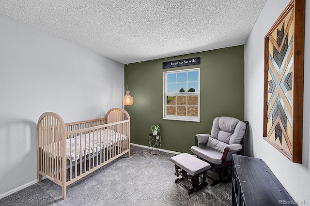 4782 E Costilla Ave, Centennial, CO 80122 - carpeted bedroom featuring a textured ceiling, a nursery area, and baseboards