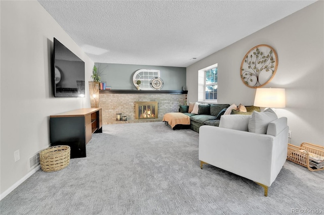4782 E Costilla Ave, Centennial, CO 80122 - carpeted living area featuring a textured ceiling and a brick fireplace