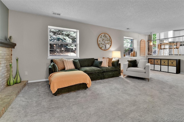 4782 E Costilla Ave, Centennial, CO 80122 - carpeted living room with a textured ceiling and a fireplace
