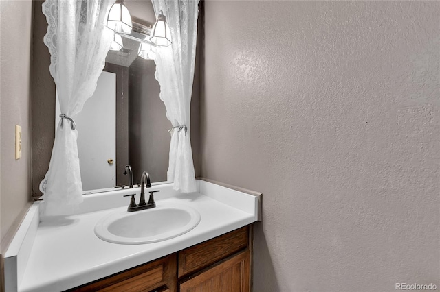 4782 E Costilla Ave, Centennial, CO 80122 - bathroom with vanity and a textured wall