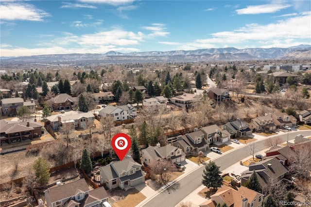 drone / aerial view featuring a mountain view and a residential view