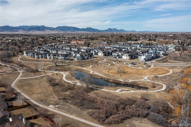 birds eye view of property with a residential view and a water and mountain view