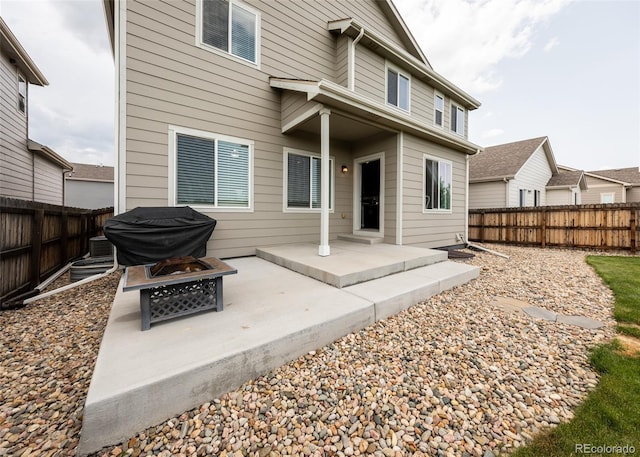 9835 Rubicon Dr, Colorado Springs, CO 80925 - rear view of property featuring a fire pit, a patio, and a fenced backyard