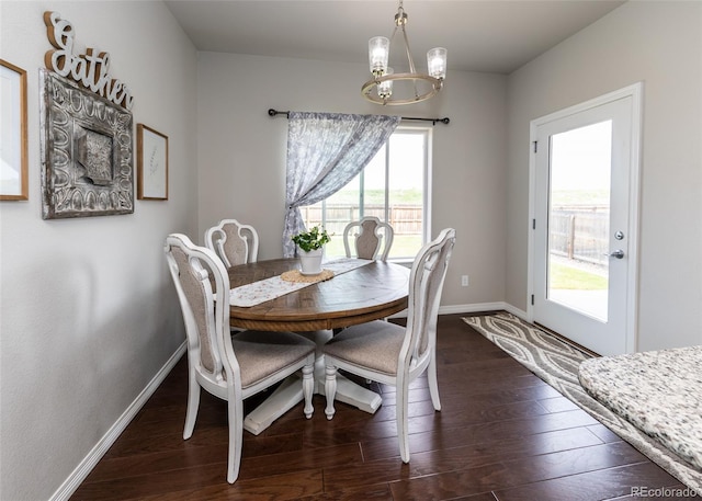 9835 Rubicon Dr, Colorado Springs, CO 80925 - dining space with baseboards, dark wood-type flooring, and a chandelier