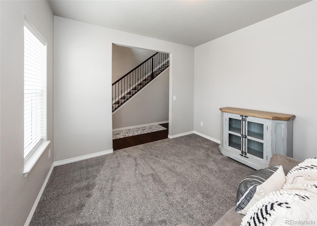 9835 Rubicon Dr, Colorado Springs, CO 80925 - living room with carpet flooring, stairs, and baseboards