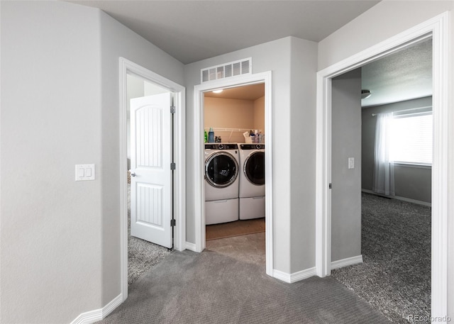 9835 Rubicon Dr, Colorado Springs, CO 80925 - laundry area with washer and dryer, carpet, and baseboards