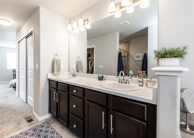 9835 Rubicon Dr, Colorado Springs, CO 80925 - bathroom featuring double vanity