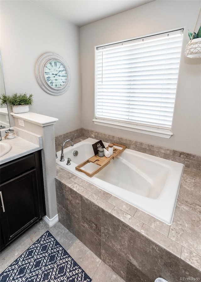 9835 Rubicon Dr, Colorado Springs, CO 80925 - full bathroom featuring vanity and a garden tub