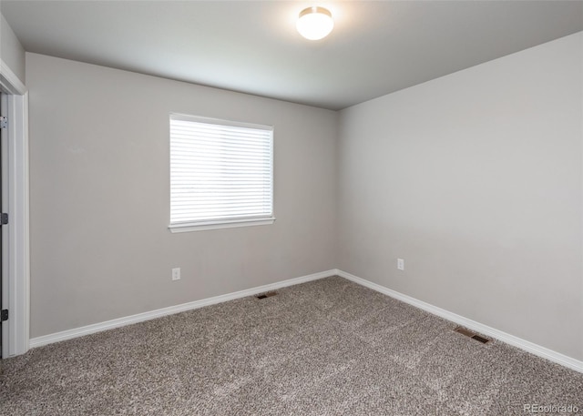 9835 Rubicon Dr, Colorado Springs, CO 80925 - carpeted empty room with baseboards