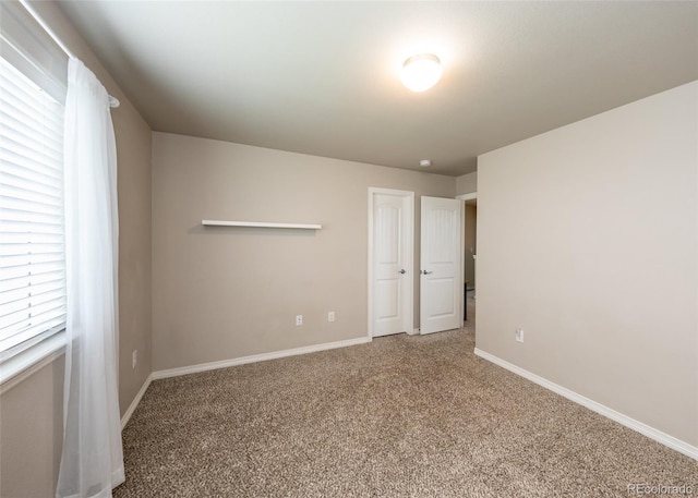 9835 Rubicon Dr, Colorado Springs, CO 80925 - unfurnished bedroom with carpet flooring and baseboards