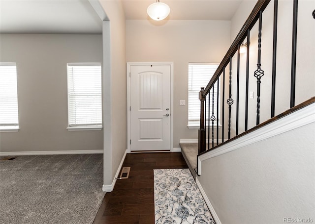 9835 Rubicon Dr, Colorado Springs, CO 80925 - foyer with plenty of natural light, baseboards, and stairway