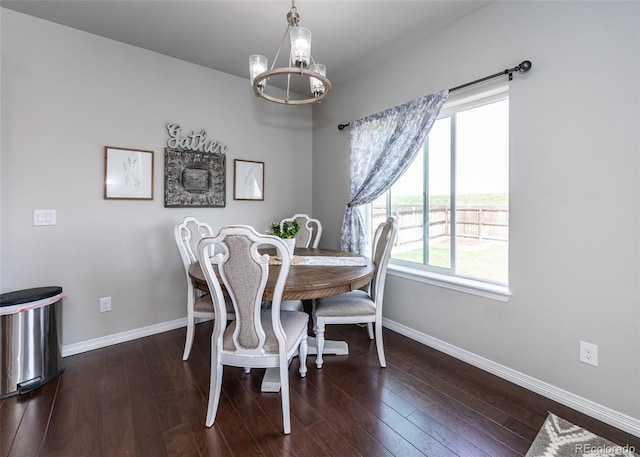 9835 Rubicon Dr, Colorado Springs, CO 80925 - dining space featuring a chandelier, baseboards, and dark wood-type flooring