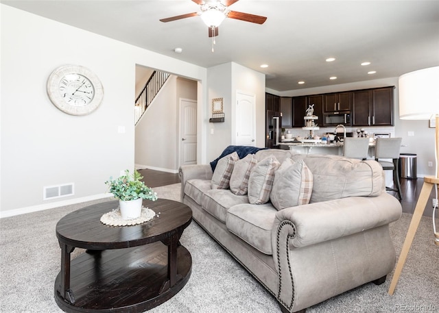 9835 Rubicon Dr, Colorado Springs, CO 80925 - living room featuring a ceiling fan, baseboards, recessed lighting, and stairs