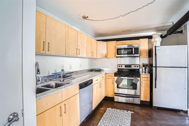 500 E 11th Ave Unit 101, Denver, CO 80203 - kitchen with stainless steel appliances, light brown cabinets, concrete flooring, and light countertops