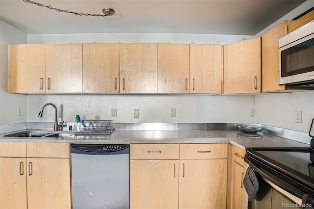 500 E 11th Ave Unit 101, Denver, CO 80203 - kitchen with stainless steel appliances and light brown cabinetry