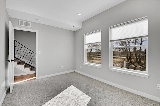 unfurnished room with carpet flooring