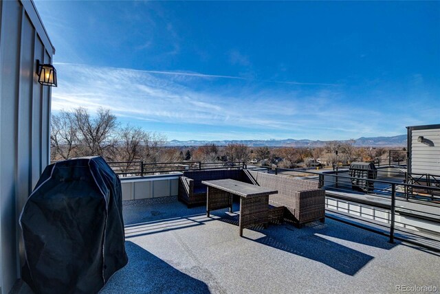 view of patio / terrace with a mountain view and grilling area