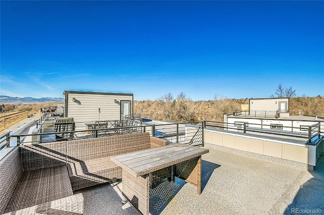 view of patio / terrace featuring a mountain view and a balcony