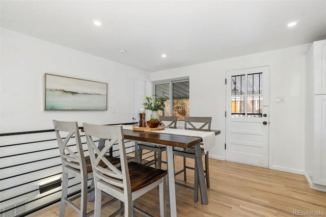 dining area featuring light wood-type flooring