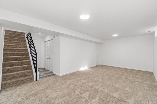 basement with light colored carpet