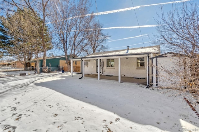 view of snow covered house